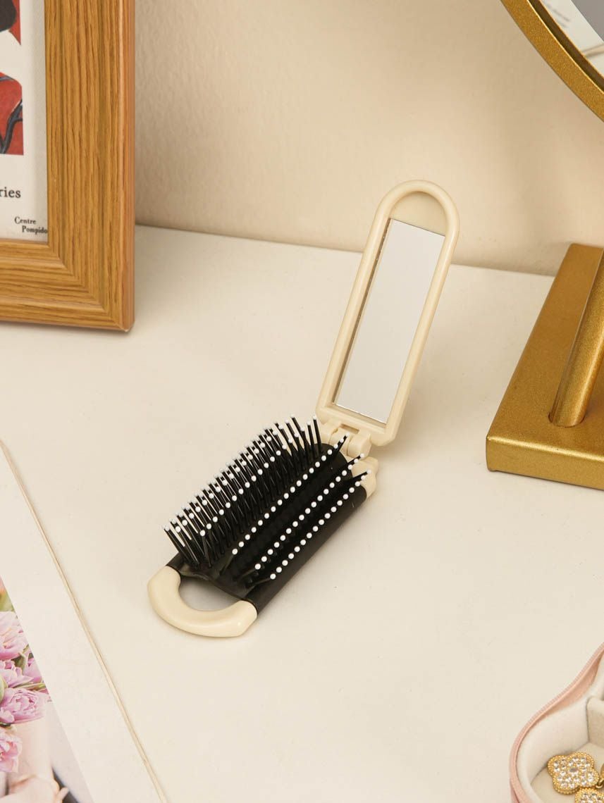 מברשת מראה מתקפלת